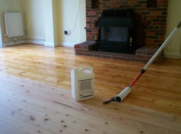 Coat wood floors with varnish