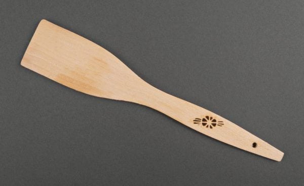 Wooden spatula for stirring the composition when cooking the primer