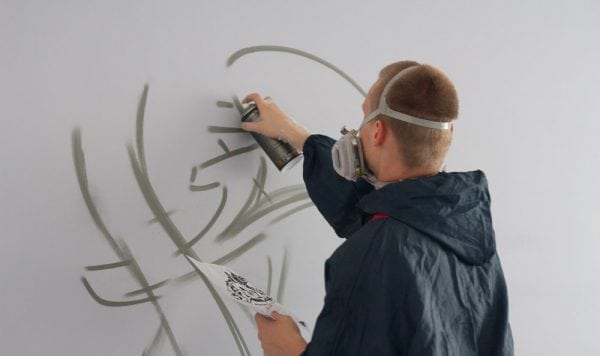 The process of decorating walls with spray paint