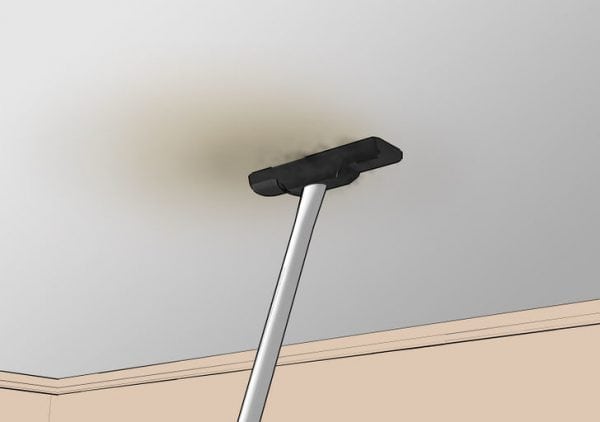 Removing gray plaque from the ceiling with a vacuum cleaner