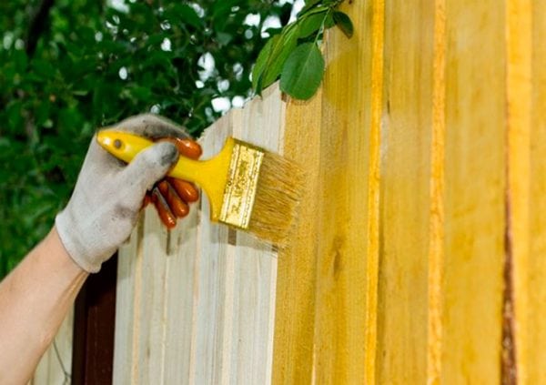 Painting a wooden fence