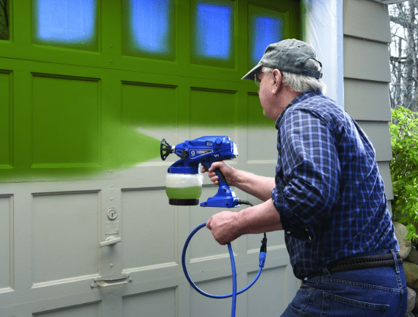 Painting with an electric spray gun of doors