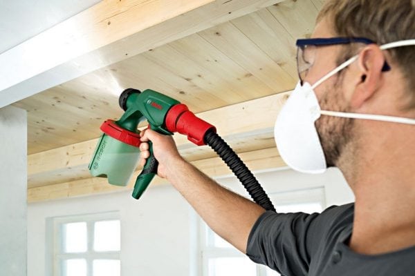 Safety glasses and a respirator when working with a spray gun