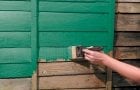 Painting the walls of a wooden house