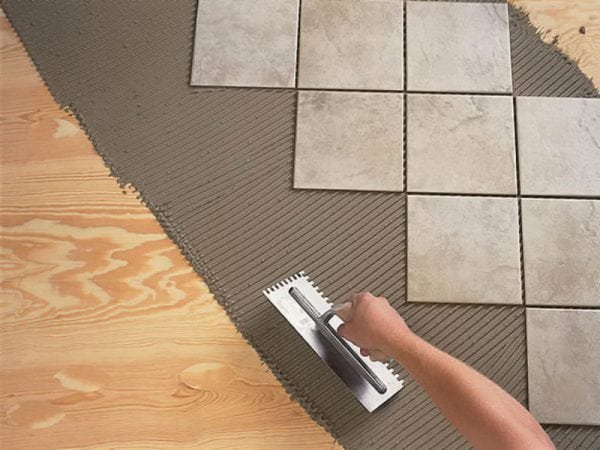 Polyurethane adhesive is used for laying tiles on a wooden base