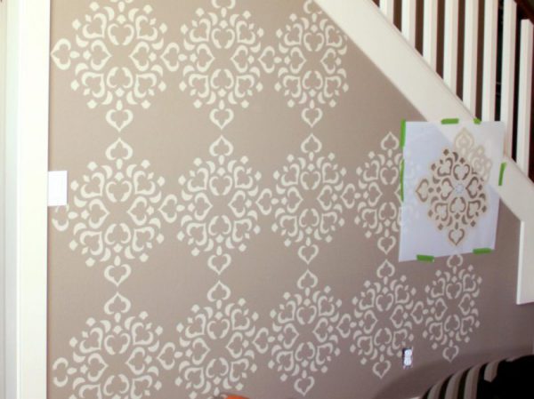 Painting walls using a stencil