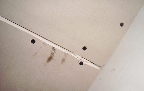 Methods for sealing joints between drywall sheets