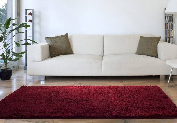 Burgundy carpet in a white interior