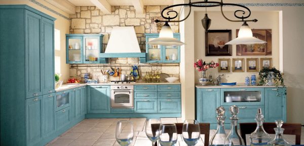 The use of blue-green tones in the design of the kitchen