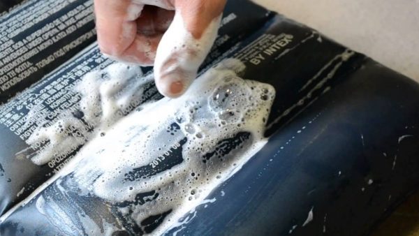 Finding a puncture with soap suds