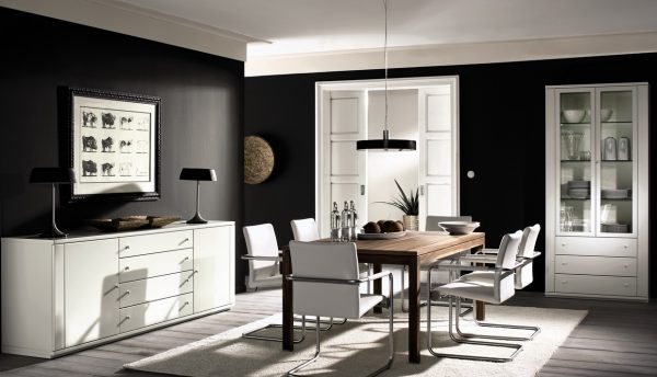 Light furniture on a background of dark walls