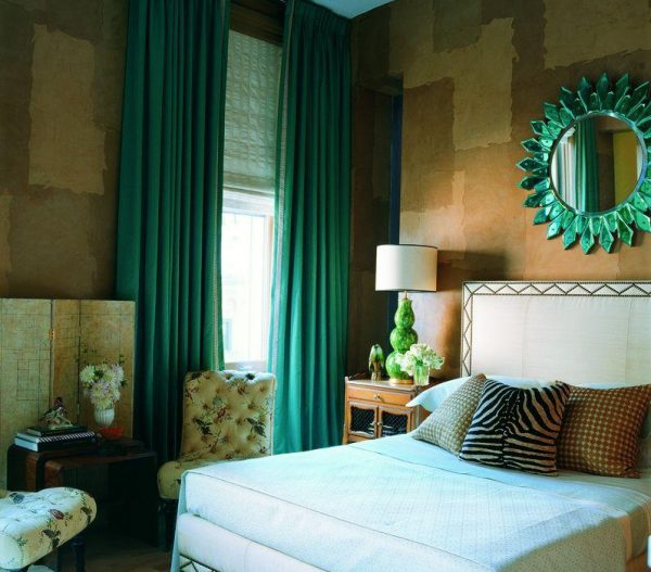 Emerald curtains in the bedroom interior