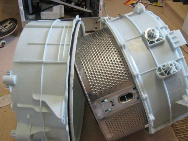 Collapsible washing machine tank