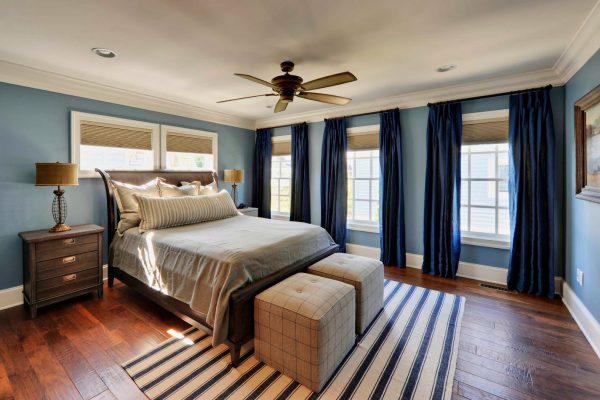 Blue curtains in the bedroom interior