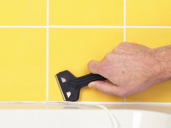 Removing old sealant from the bath