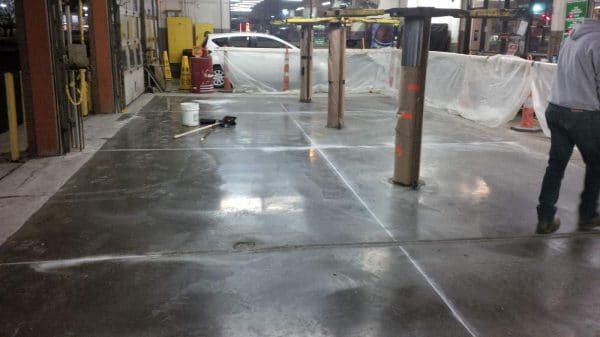 The use of concrete substitute in the repair of parking coverage