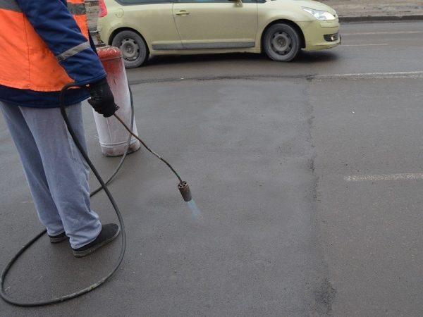 Asphalt warming up before marking