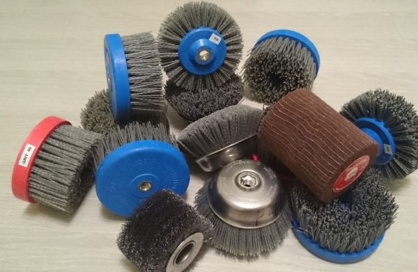 Abrasive brushing nozzles of various shapes