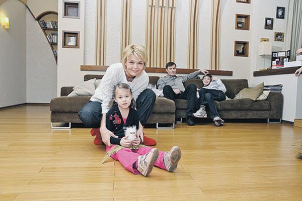 In the living room with husband and children