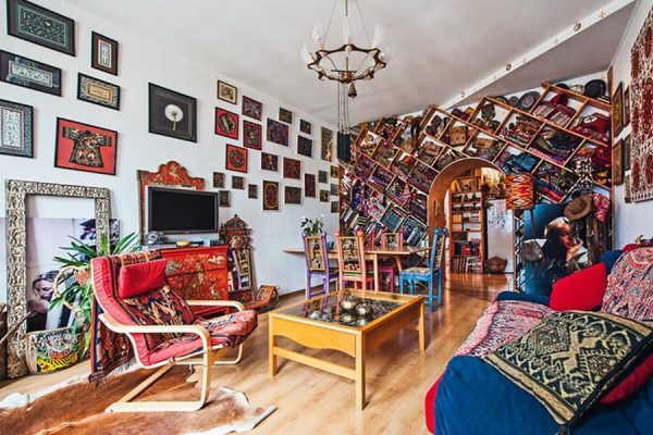 Living room in the apartment is decorated in ethnic style.