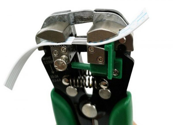 Wire stripping and crimping tool