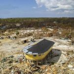 A round stilt house that stands after a hurricane