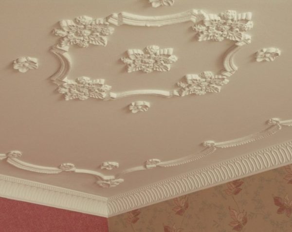 In a narrow and low room, stucco molding will look ridiculous