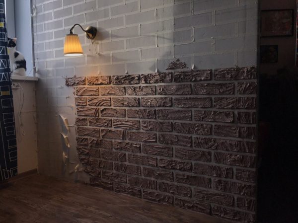 Imitation brickwork with adhesive tape