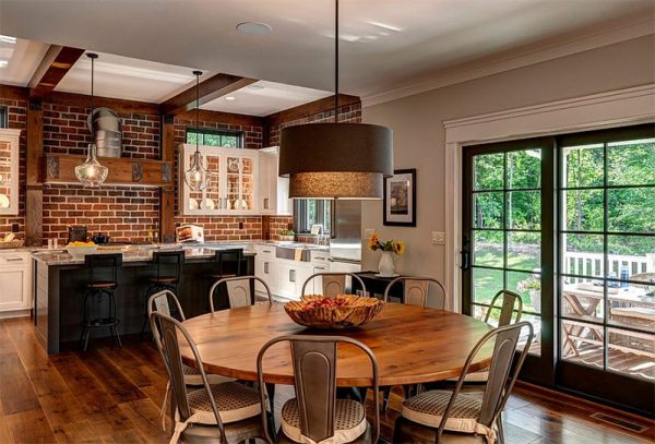 Kitchen dining room with brick wall.