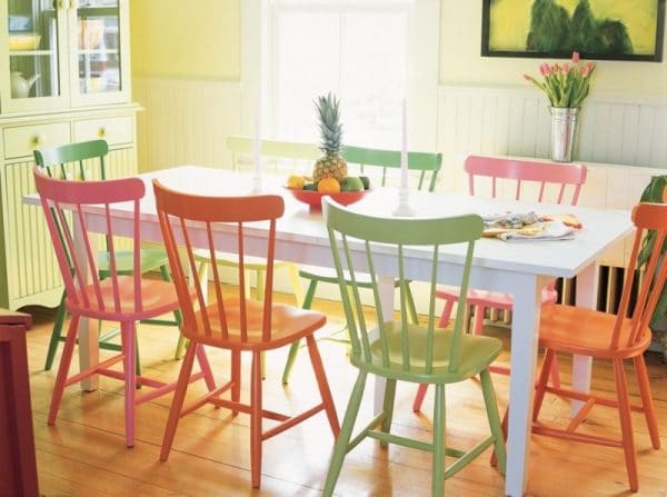 Multi-colored wooden chairs in the interior of the kitchen