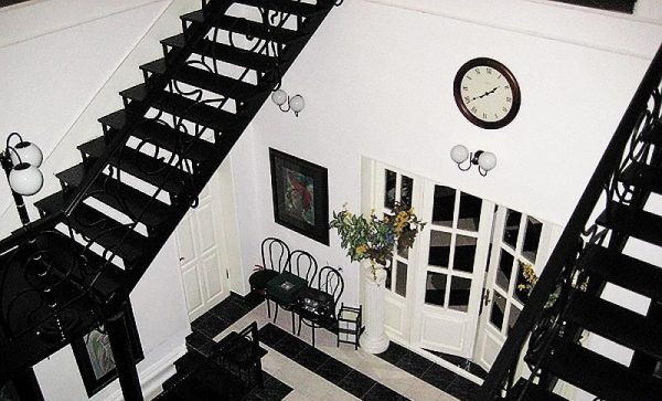 Forged black staircase in the house-museum of fashion designer Vyacheslav Zaitsev