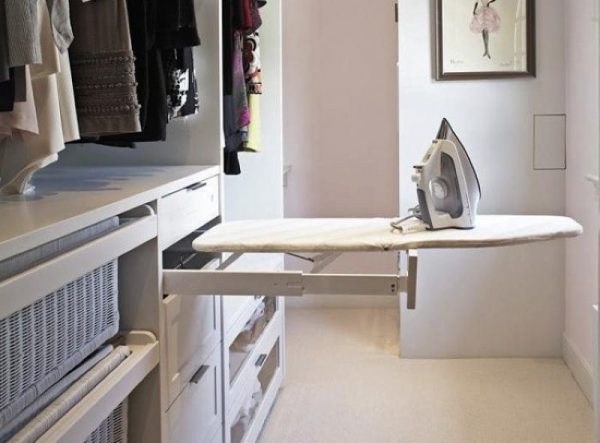 Extendable ironing board in the cabinet