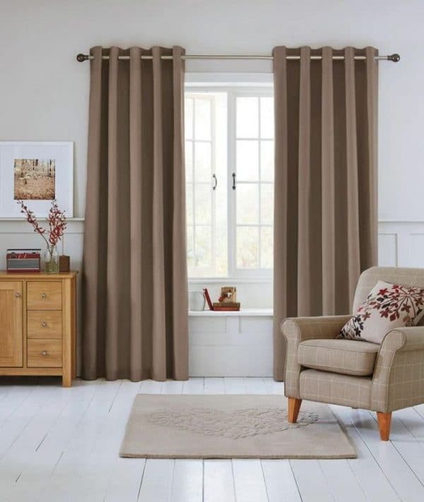 Beige curtains on grommets