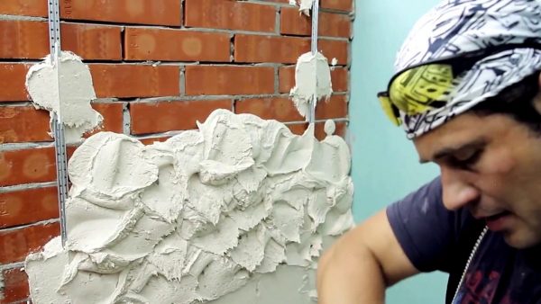 Plastering a brick wall